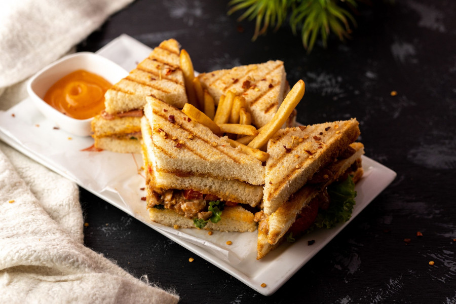 Tasty Delicious Fresh And Healhty Cooked And Prepared Sandwich In White Plate With Black Background